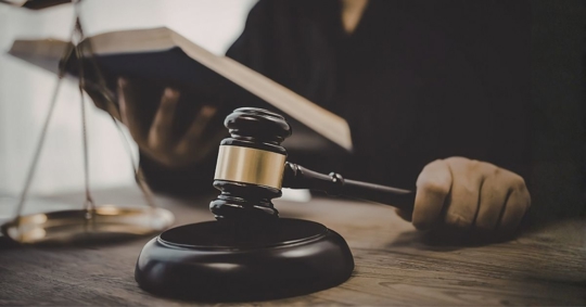 Judge's gavel on a desk in a courtroom